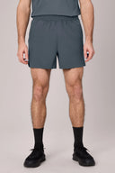 Men's granite gray athletic shorts with elastic waistband, front view on model