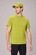 Man wearing a bright green crewneck short sleeve athletic t-shirt and matching cap