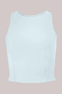 Light blue compression sports bra with high neckline, seamless design, athleisure activewear