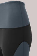 High-waisted colour-blocked cropped leggings in charcoal and black, close-up view