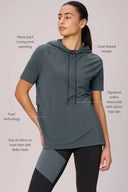 Woman wearing granite short sleeve pima cotton hoodie with drawcords and mesh panel leggings