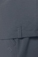 Close-up of granite grey boys' athletic tee and pants with pocket and stitched tag detail