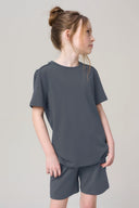 Girl wearing granite grey short sleeve athletic tee and matching shorts