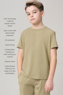 Boy wearing light olive green athleisure t-shirt and pants with performance features listed