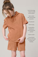 Girl wearing mocha athleisure tee and shorts set, with comfort and performance features