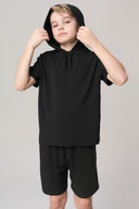 Boy wearing charcoal hooded tee and shorts, PFAS-free boys athleisure apparel