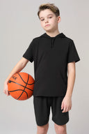Boy in charcoal hooded short sleeve tee and shorts holding a basketball, athletic wear