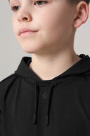 Boy wearing charcoal hooded tee with drawstrings and minimal geometric logo