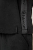Close-up of charcoal boys’ hooded tee with side logo tape and front pocket detail