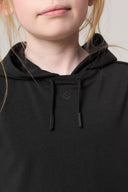 Close-up of girl wearing charcoal hooded activewear tee with drawstrings