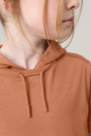 Close-up of girl wearing mocha brown hooded athleisure tee with drawstrings
