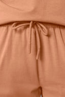 Close-up of mocha brown women's shorts with drawstring waist, soft athleisure fabric