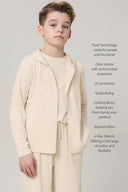 Boy wearing a sand-colored kids UV hoodie and pants set, with product feature text overlay
