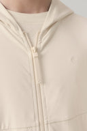 Close-up of kids sand-colored UV hoodie zipper and textured fabric