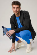 Man in charcoal fitted athleisure jacket, blue activewear, holding a water bottle