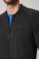 Close-up of man wearing charcoal fitted athletic jacket with zip and subtle logo