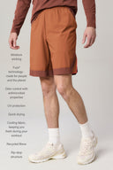 Man wearing dark suntan athletic shorts with moisture-wicking, UV protection, and recycled fibers