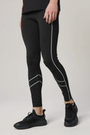 Man wearing charcoal reflective athletic leggings with curved white lines