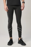Man wearing charcoal reflective zebra-pattern leggings with athletic shoes