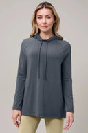 Woman wearing granite gray long sleeve pima hoodie with drawstrings, athleisure style