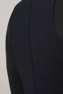 Close-up of charcoal activewear tee with subtle logo detail and smooth athletic fabric