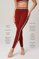 Woman wearing high-waisted merlot leggings with side stripes, showcasing athletic fit.
